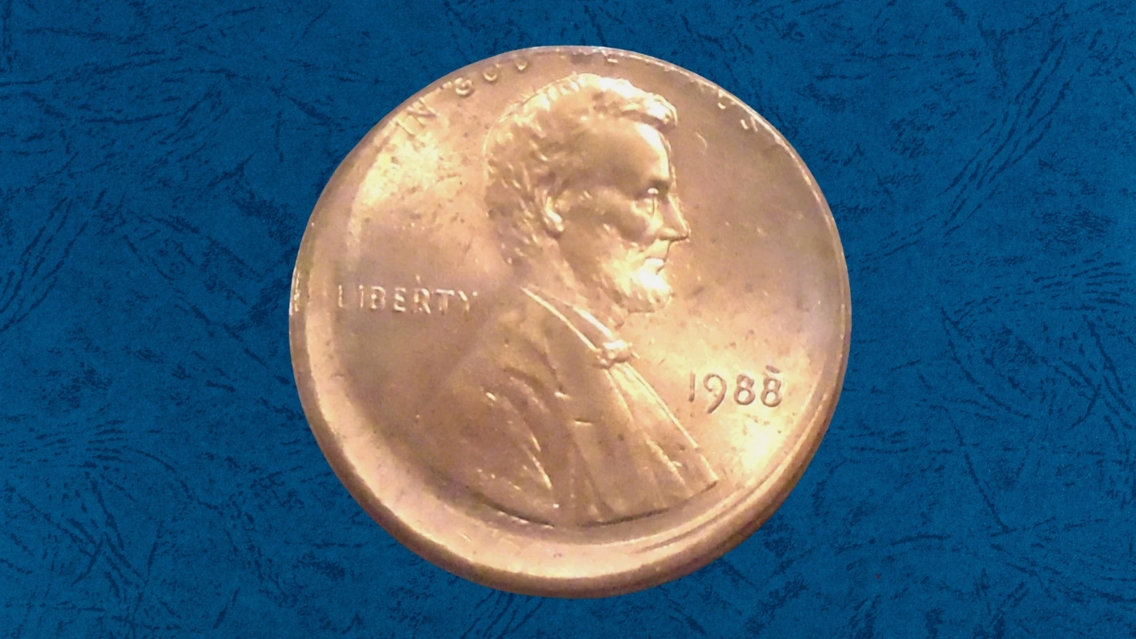 1988 penny off-center strike error showing approximately 40% offset with readable date and visible blank planchet crescent